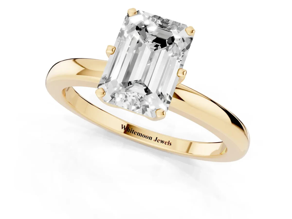 Emerald Cut Solitaire Diamond Ring with Six-Prong Setting on a Classic Band Yellow gold