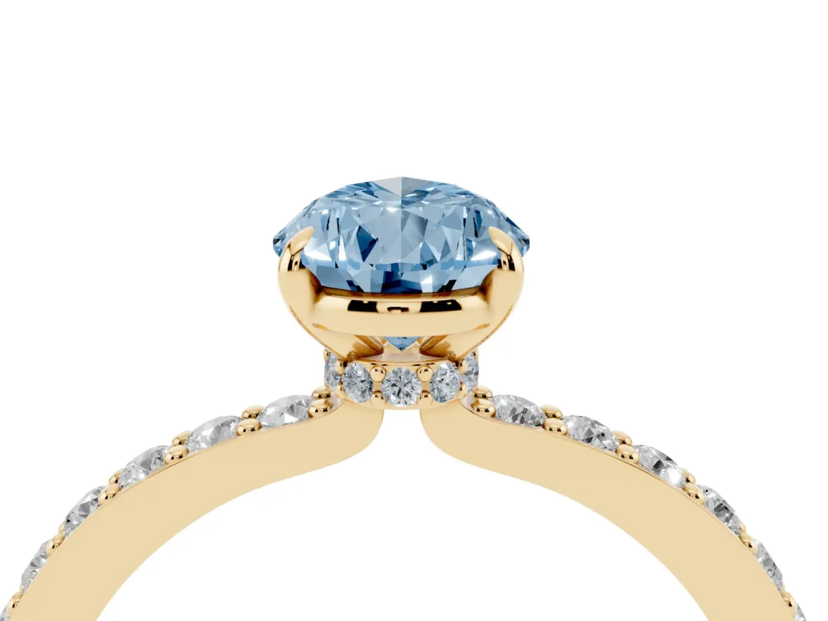 Fancy Blue Pear Cut Diamond Pavé Engagement Ring with Round Accents and Prong Setting Yellow gold