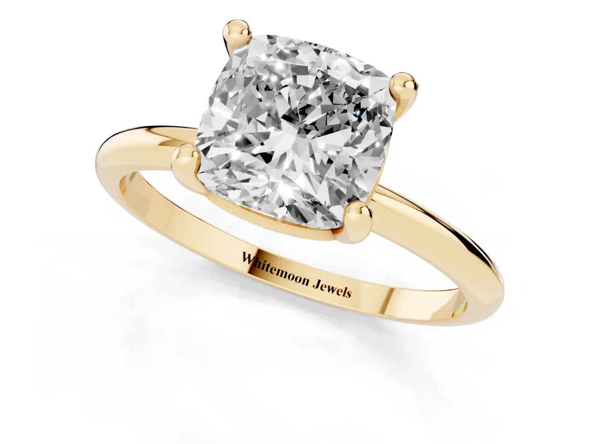 Cushion Cut Solitaire Diamond Ring with 4-Prong Setting on a Classic Band Yellow gold