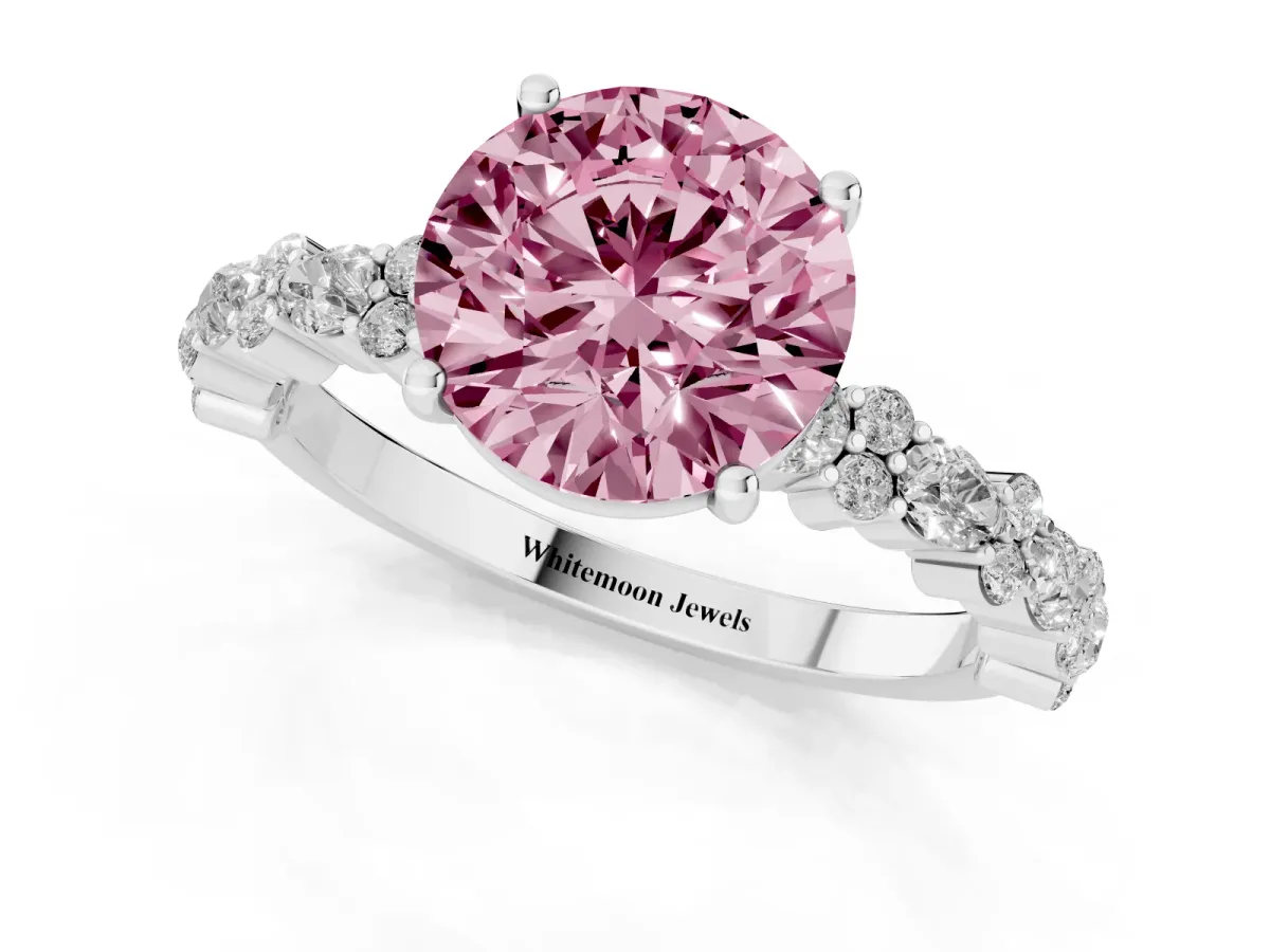 Fancy Pink Round Cut Diamond Side Stone Solitaire Ring with Round and Four-Prong Setting Platinum