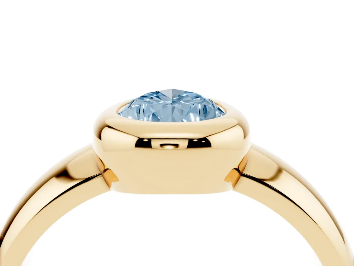 Fancy Blue Bezel Set Pear Cut Solitaire Ring with Wide Band Yellow gold