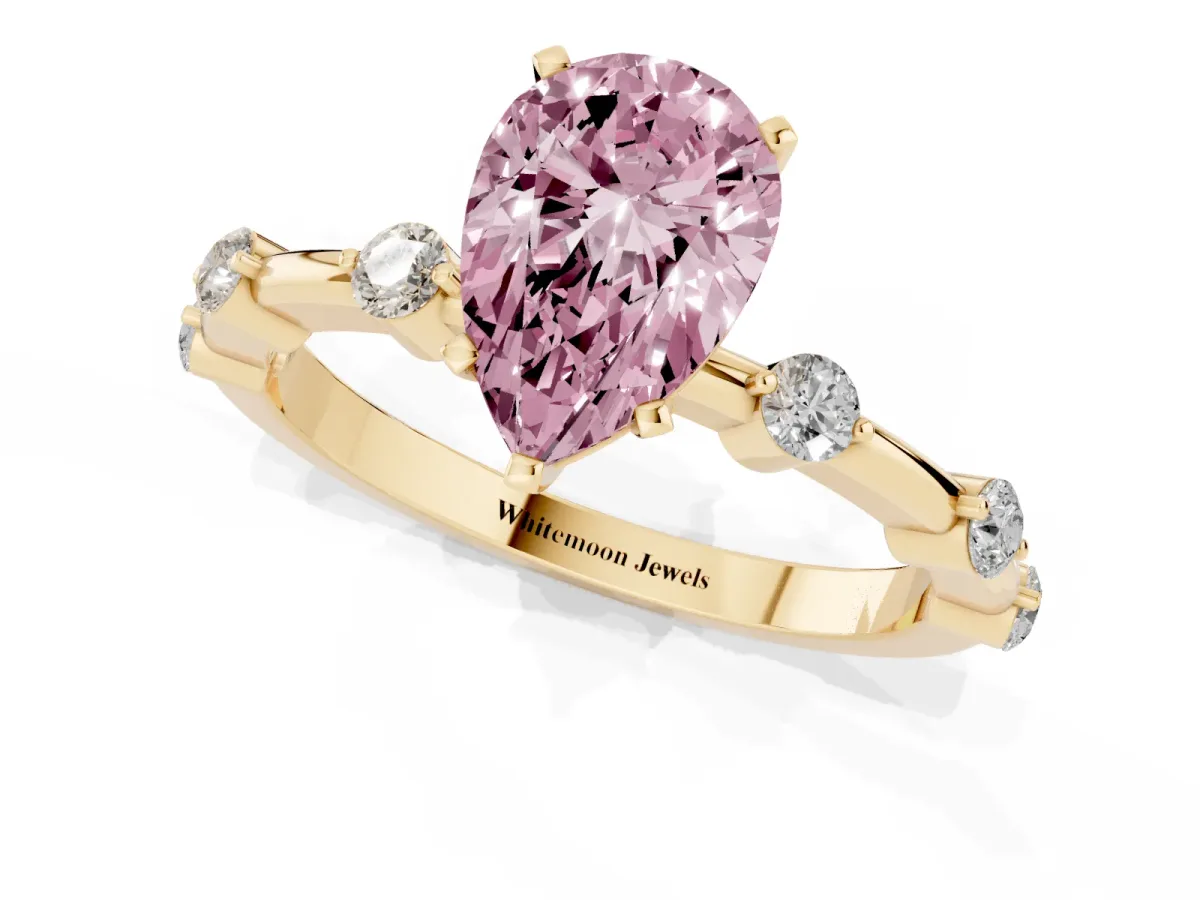 Fancy Pink Pear Cut Solitaire Diamond Ring with Bezel Set Side Stones and Prong Setting Yellow gold