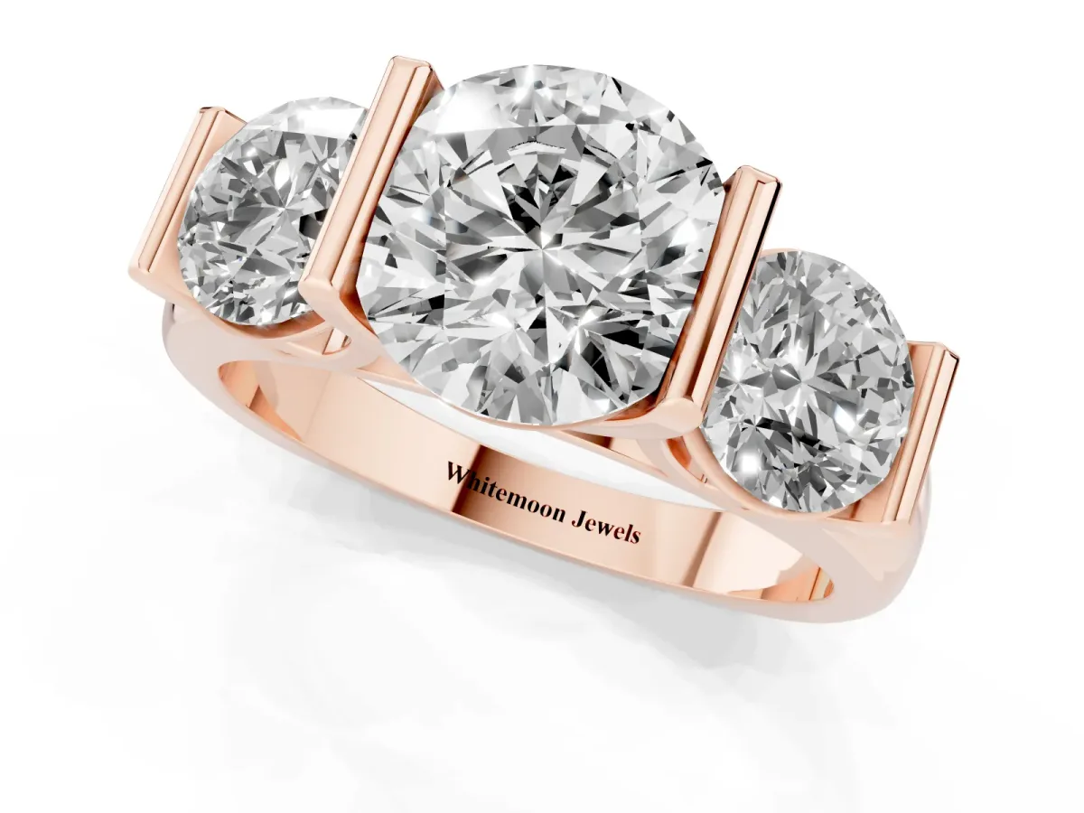Three-Stone Round Cut Brilliant Diamond Ring with Channel Setting and White Gold Band Rose gold