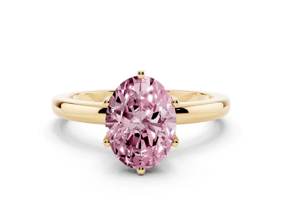 Fancy Pink Oval Cut Solitaire Diamond Ring with Six-Prong Setting on a Classic Band Yellow gold
