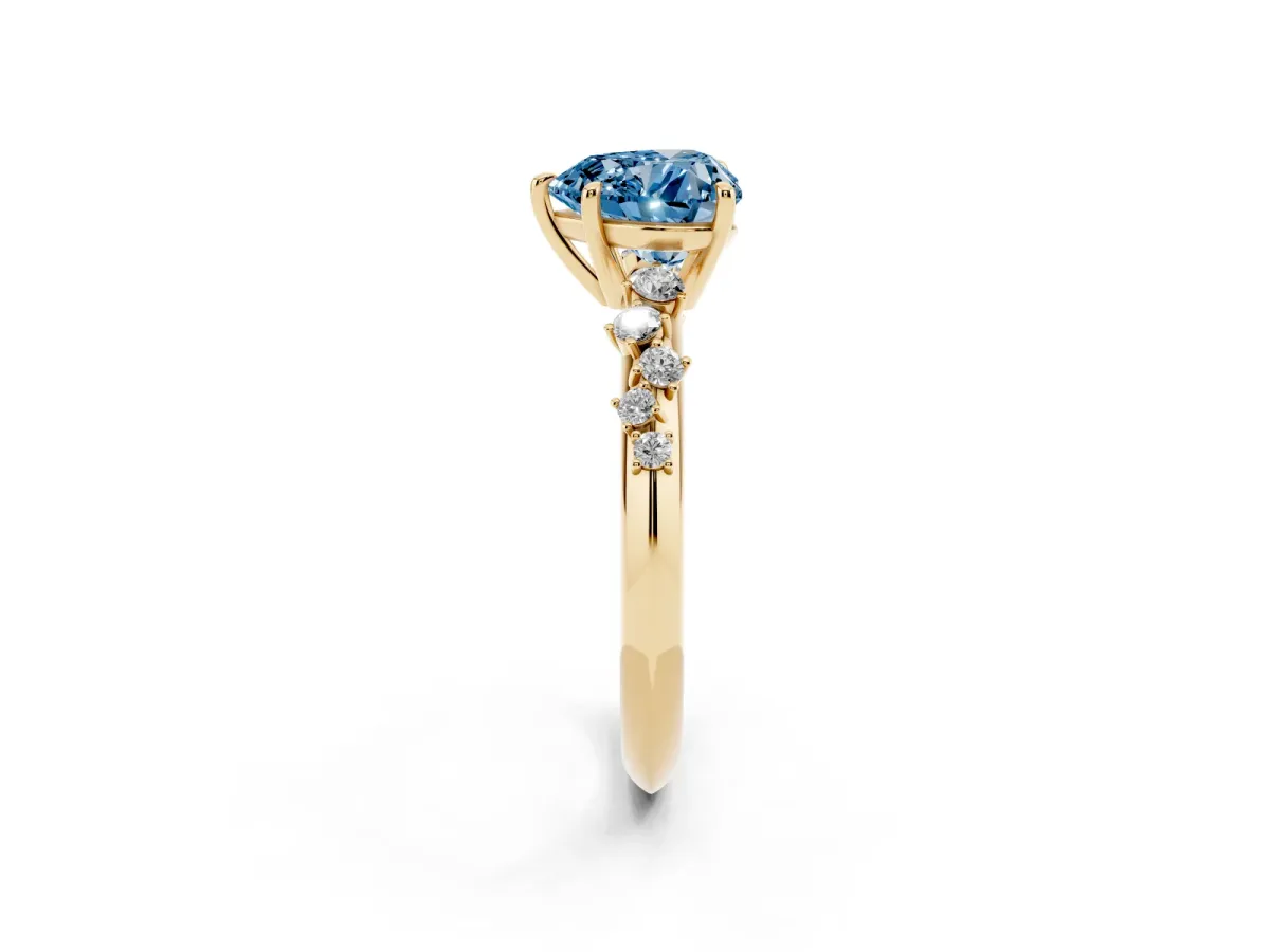 Fancy Blue Heart Cut Diamond Cluster Side Stone Solitaire Ring with Prong Setting Yellow gold