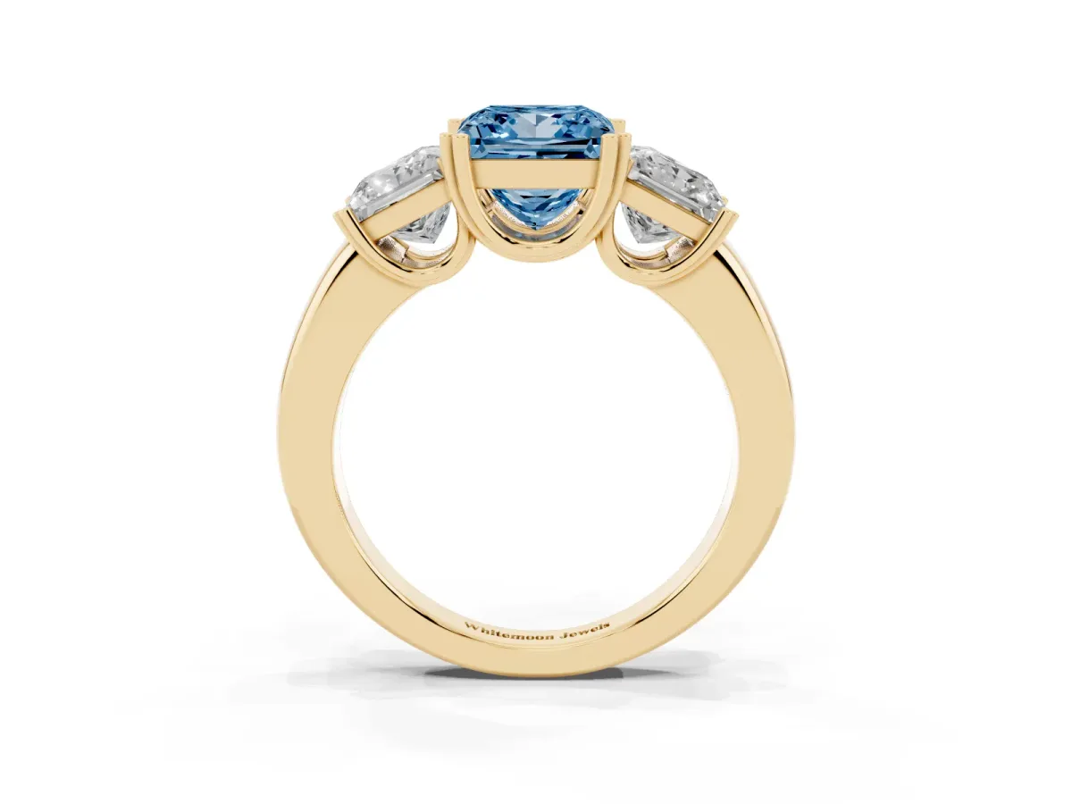 Fancy Blue Three-Stone Princess Cut Cut Diamond Ring with Channel Set Band and Four-Prong Setting Yellow gold