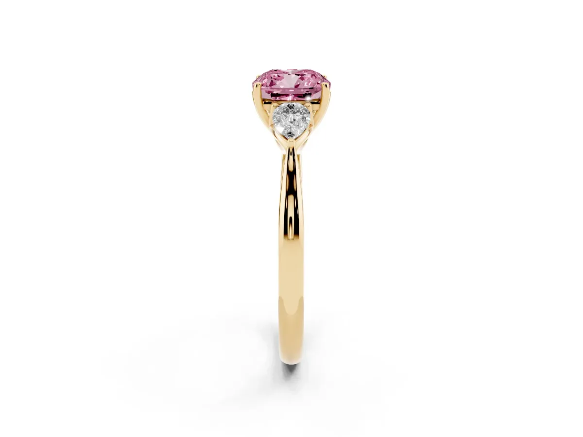 Fancy Pink Three-Stone Cushion Cut Diamond Ring with Pear Side Stones in Four-Prong Setting Yellow gold