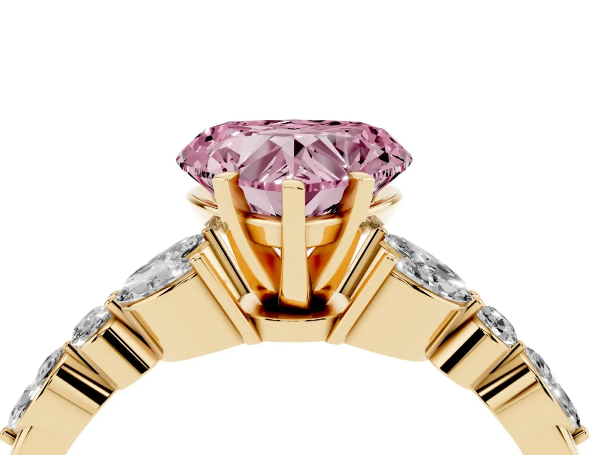 Fancy Pink Heart Cut Diamond Solitaire Ring with Side Stones and Four-Prong Setting Yellow gold