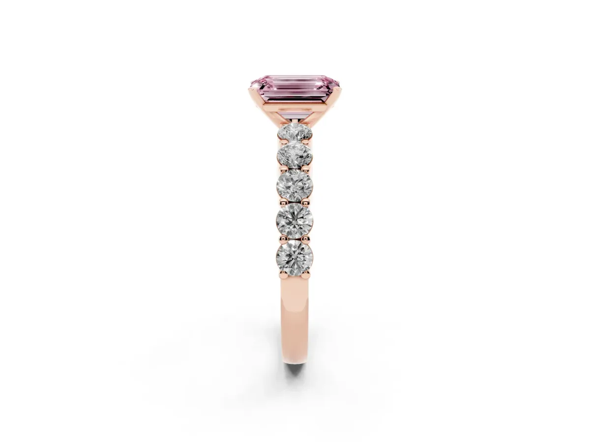 Fancy Pink Emerald Cut Diamond Solitaire Ring with Shared Prong Round Side Stones Rose gold