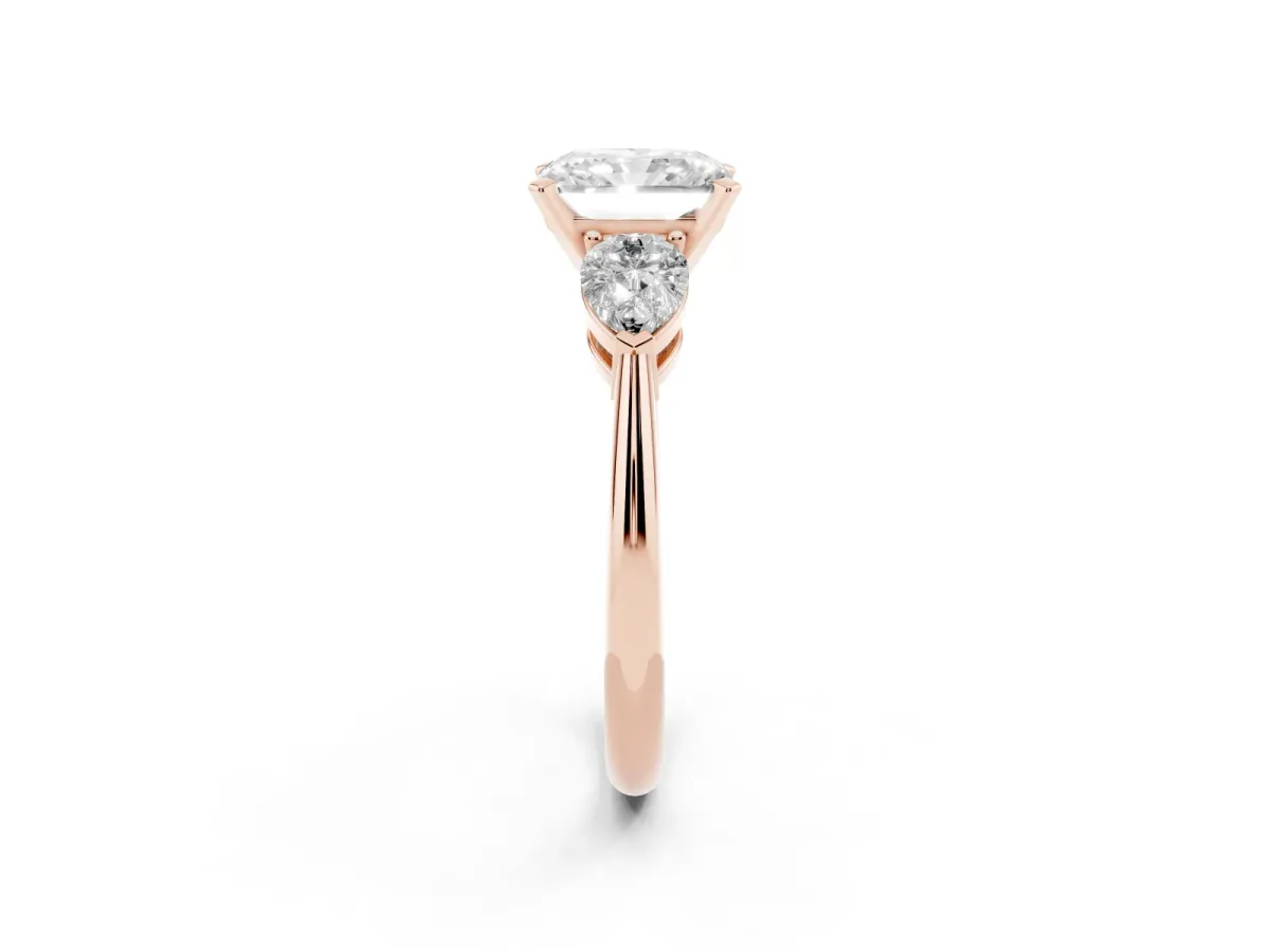 Three-Stone Radiant Cut Diamond Ring with Pear Side Stones and Four-Prong Setting Rose gold