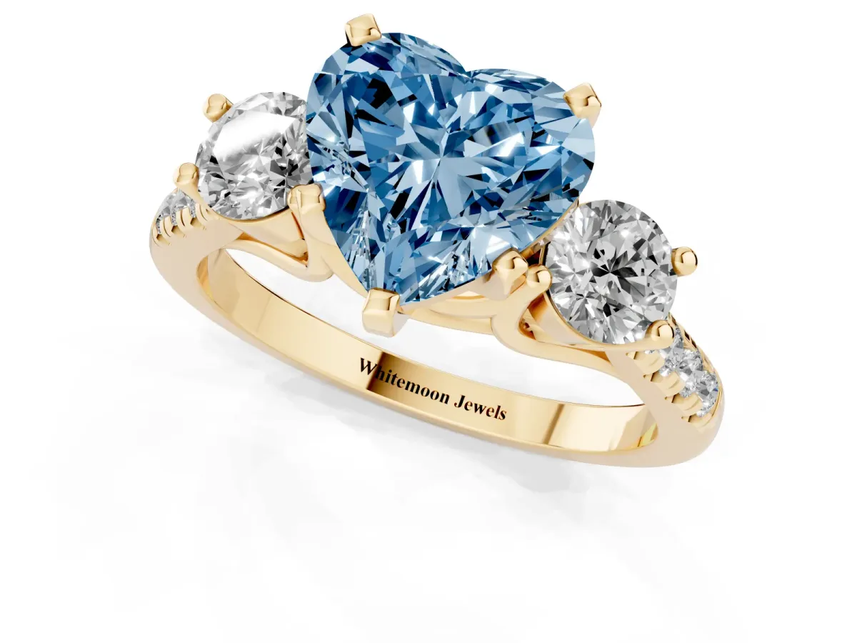 Fancy Blue Three-Stone Heart Cut Diamond Pavé Band with Four-Prong Setting Yellow gold