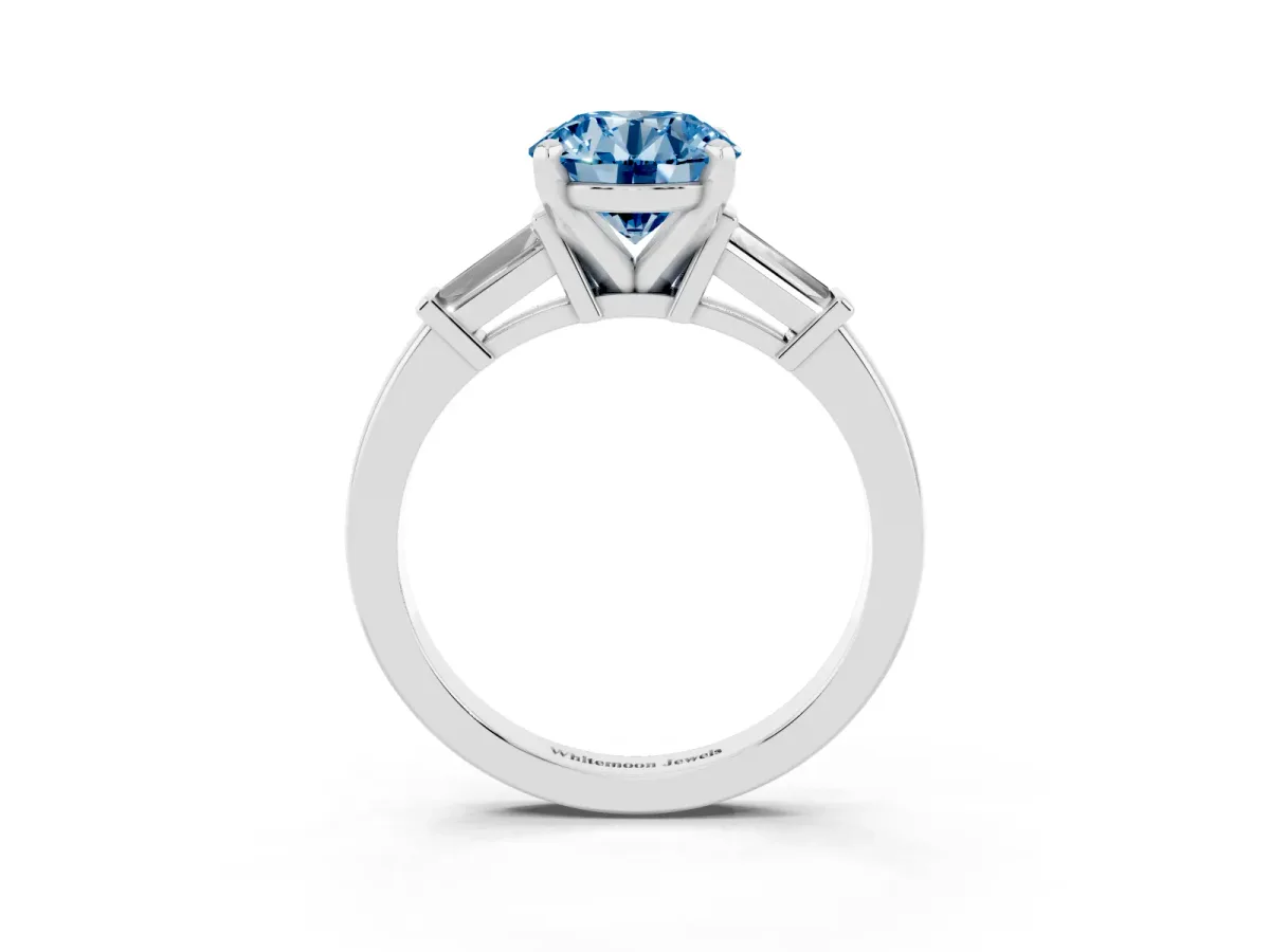Fancy Blue Round Cut Cut Diamond Solitaire Ring with Tapered Baguette Accents and Four-Prong Setting White gold