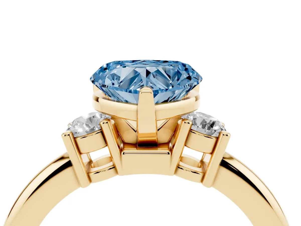 Fancy Blue Three-Stone Heart Cut Cut Diamond Solitaire with Prong Setting and Classic Band Yellow gold
