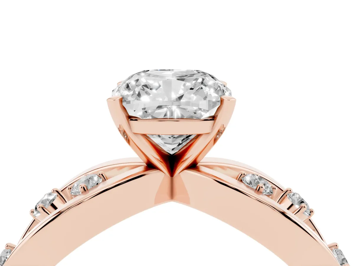 Cushion Cut Cut Solitaire Diamond with Side Stones on Criss-Cross Band and Four-Prong Setting Rose gold