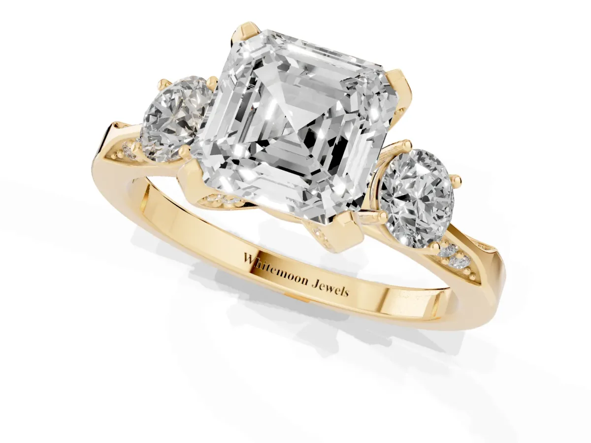 Asscher Cut Brilliant Three-Stone Diamond Ring with Pavé Band and Four-Prong Setting Yellow gold