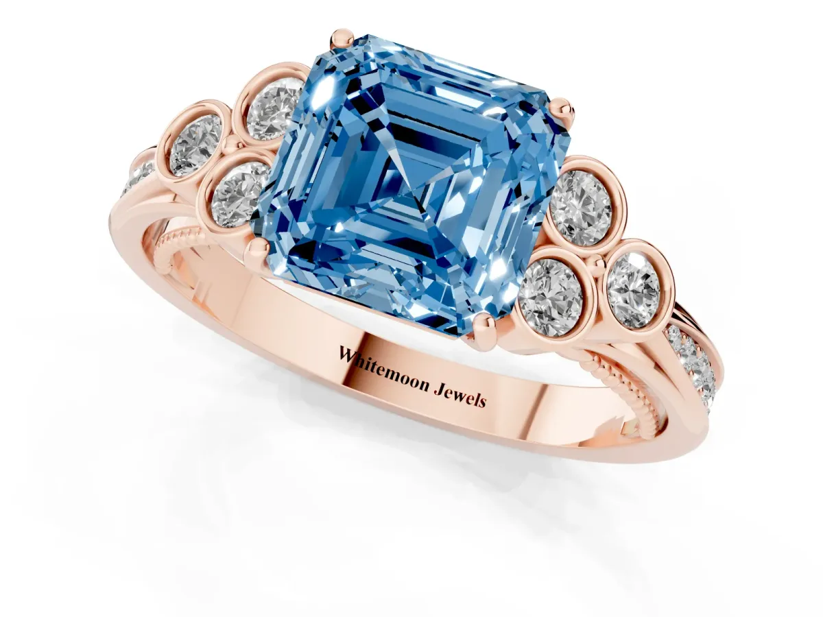 Fancy Blue Asscher Cut Cut Diamond Engagement Ring with Bezel Set Round Side Stones and Prong Setting Rose gold