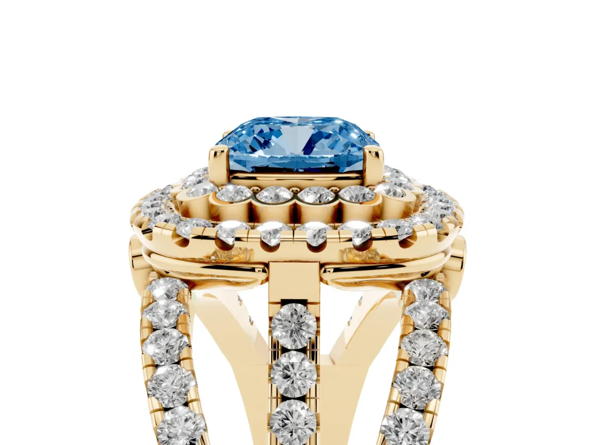 Fancy Blue Cushion Cut Diamond Double Halo Ring with Round Pavé Split Shank and Prong Setting Yellow gold