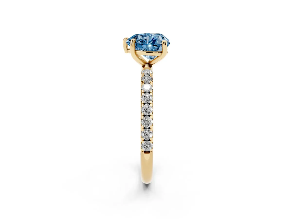 Fancy Blue Heart Cut Cut Diamond Solitaire Ring with Micro Pave Band and Four Prong Setting Yellow gold