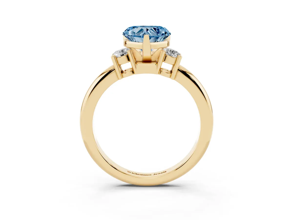 Fancy Blue Three-Stone Heart Cut Cut Diamond Solitaire with Prong Setting and Classic Band Yellow gold