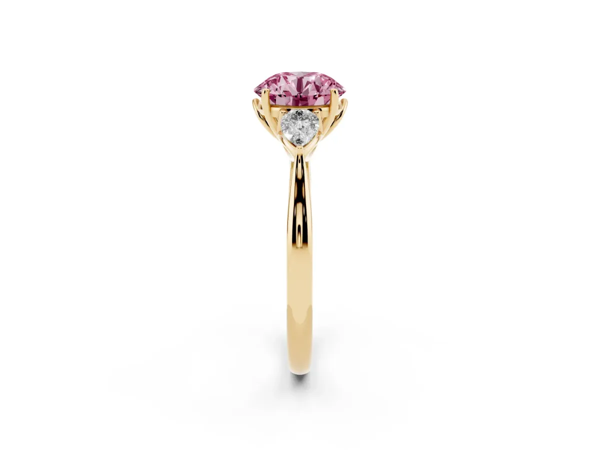 Fancy Pink Round Cut Diamond Three-Stone Ring with Pear Side Stones and Prong Setting Yellow gold