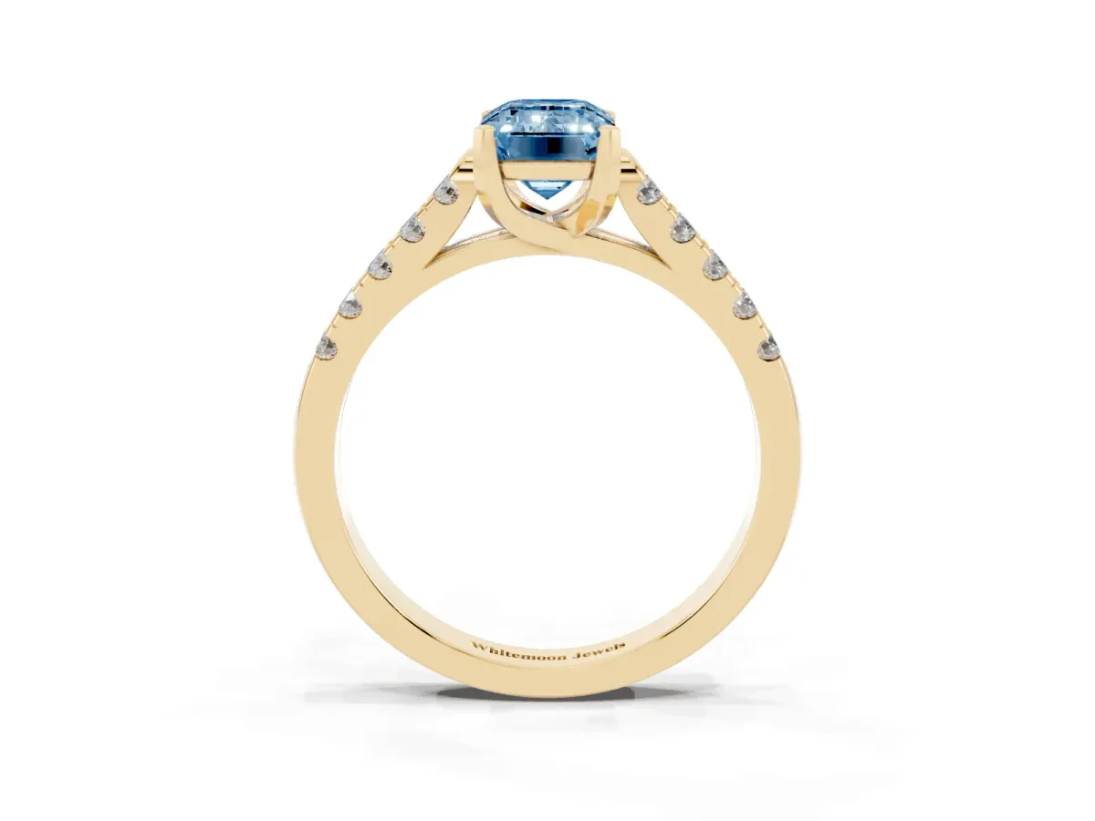 Fancy Blue Emerald Cut Diamond Pavé Band Solitaire Ring with Prong Setting Yellow gold