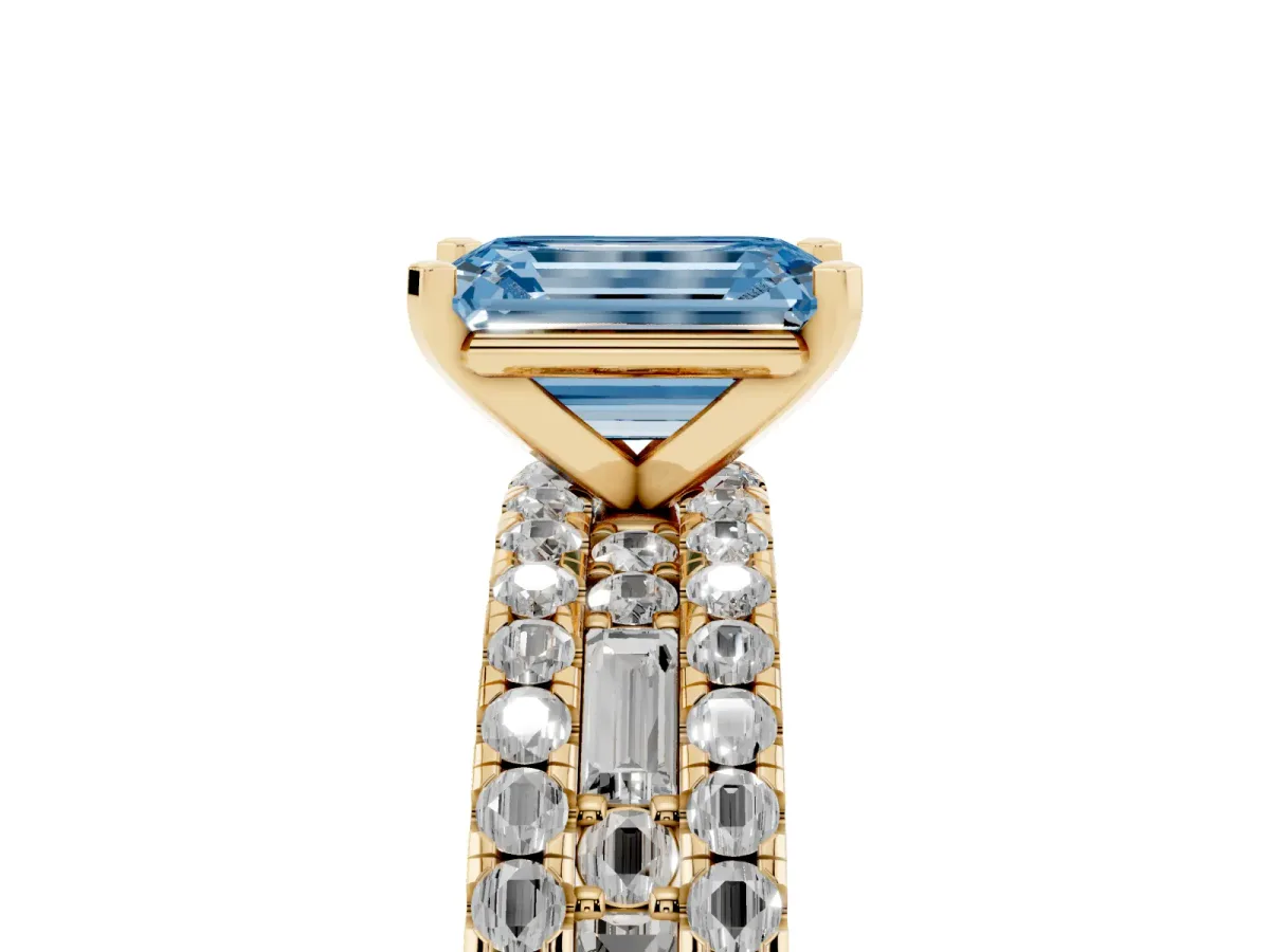 Fancy Blue Emerald Cut Diamond Solitaire Ring with Pavé and Channel Set Band Yellow gold