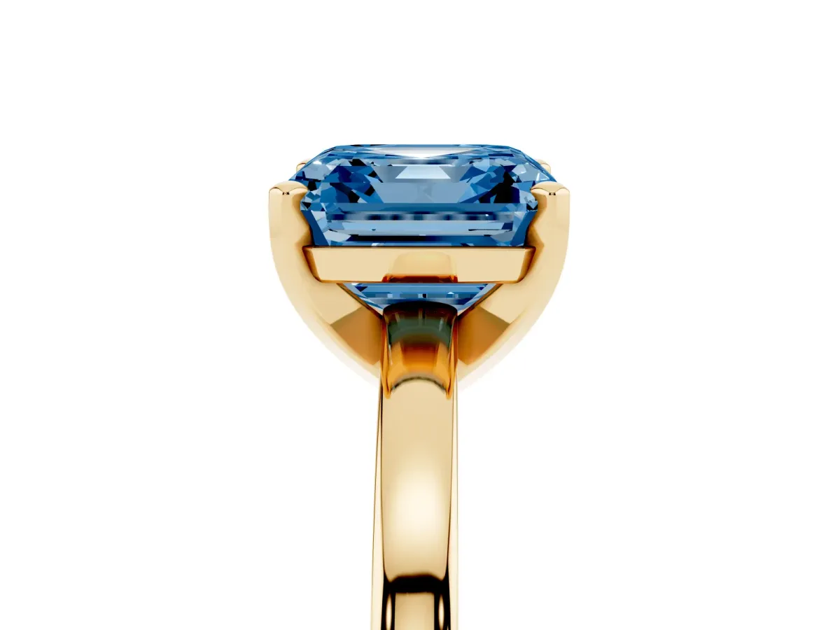 Fancy Blue Asscher Cut Solitaire Diamond Engagement Ring with Four-Prong Setting on a Classic Band Yellow gold