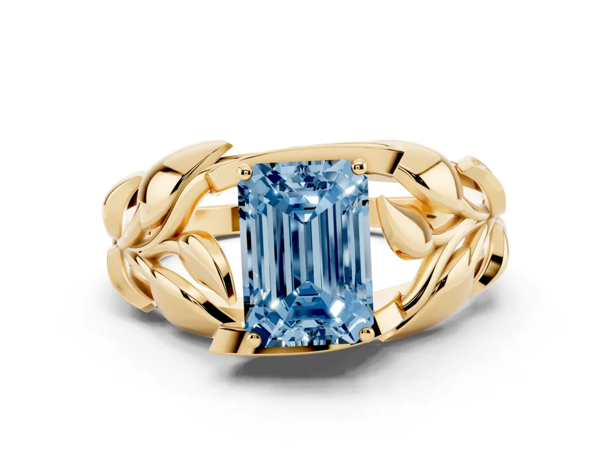 Fancy Blue Emerald Cut Diamond Leaf-Inspired Engagement Ring with Round Accents and Prong Setting Yellow gold