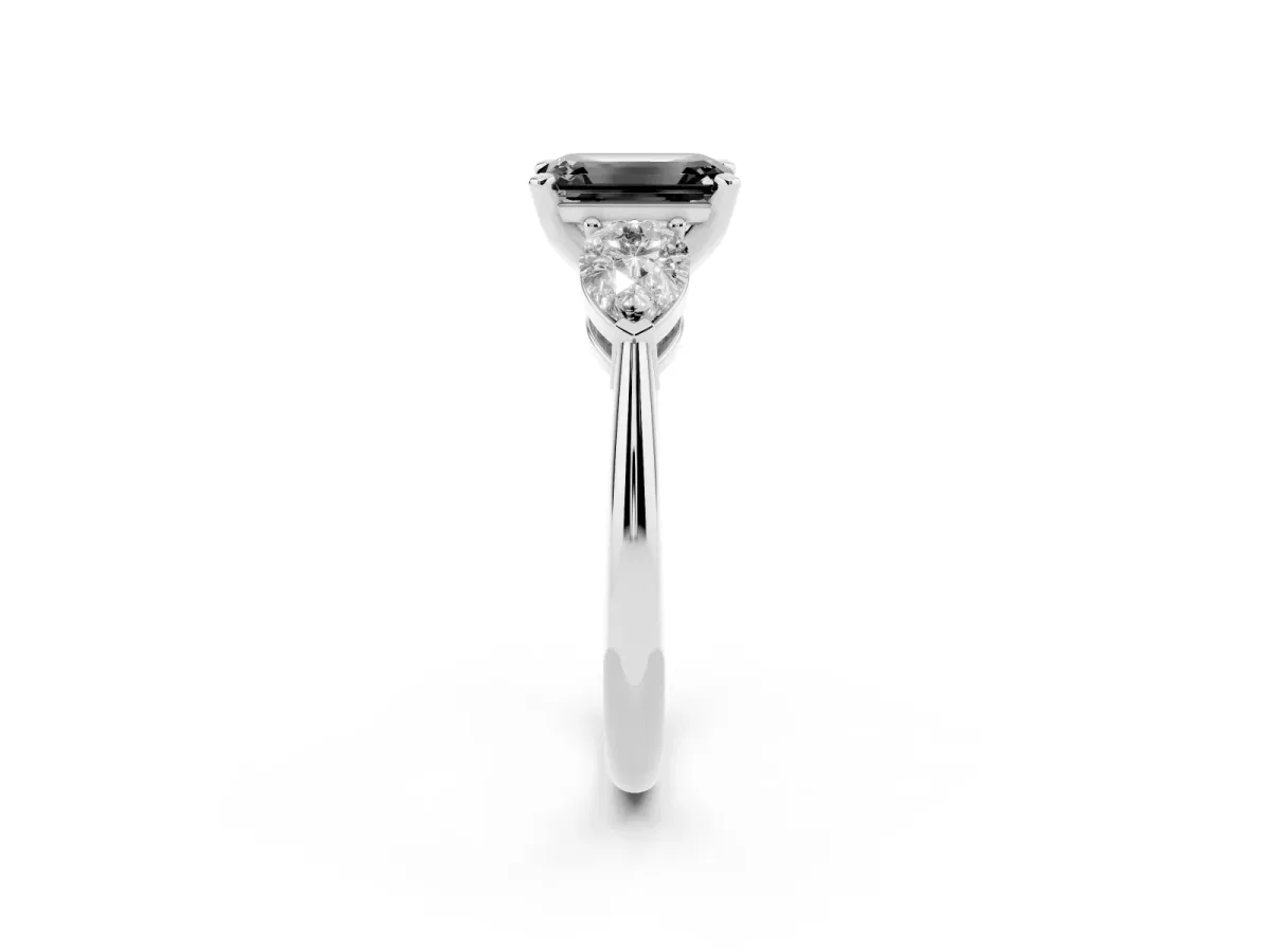 Fancy Black Three-Stone Emerald Cut Diamond Ring with Pear Side Stones and Four-Prong Setting Platinum