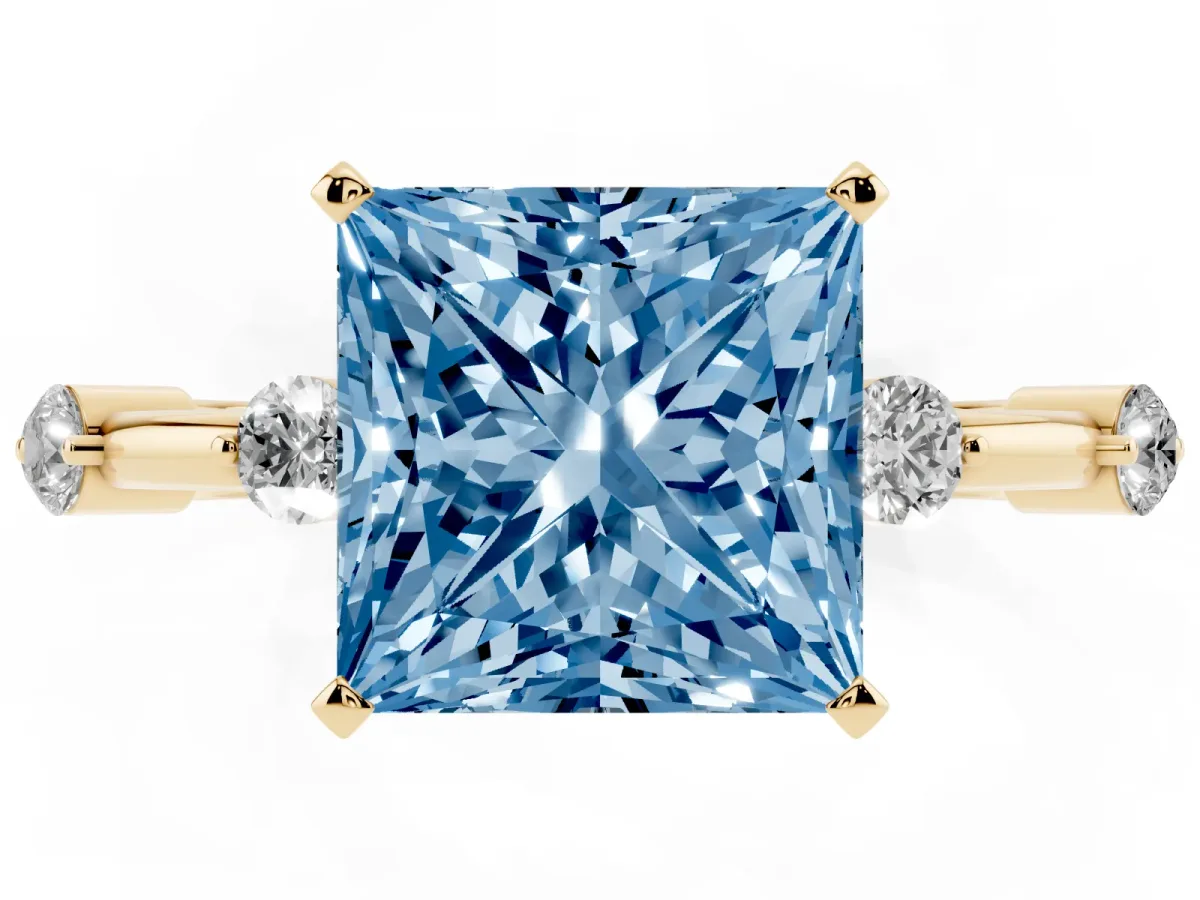 Fancy Blue Princess Cut Solitaire Diamond Ring with Bezel Set Side Stones and Prong Setting Yellow gold