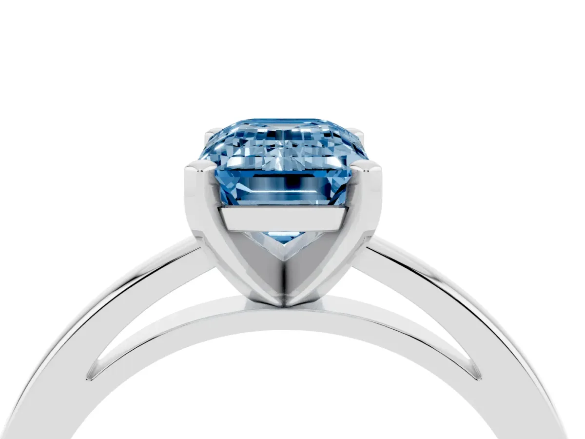 Fancy Blue Emerald Cut Solitaire Diamond Engagement Ring with Four-Prong Setting on a Classic Band Silver