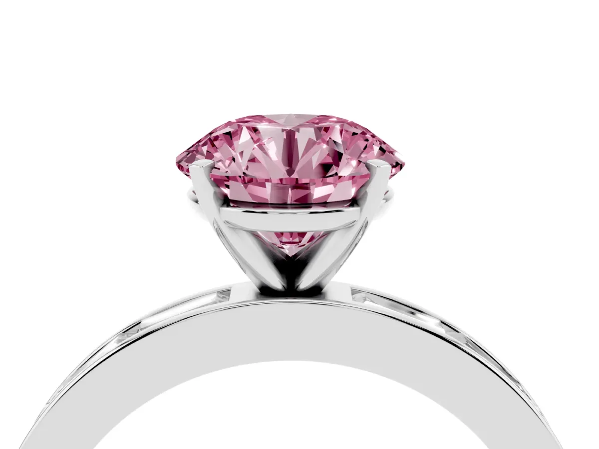Fancy Pink Round Cut Solitaire Diamond Ring with Channel-Set Baguette Band and Four-Prong Setting Silver