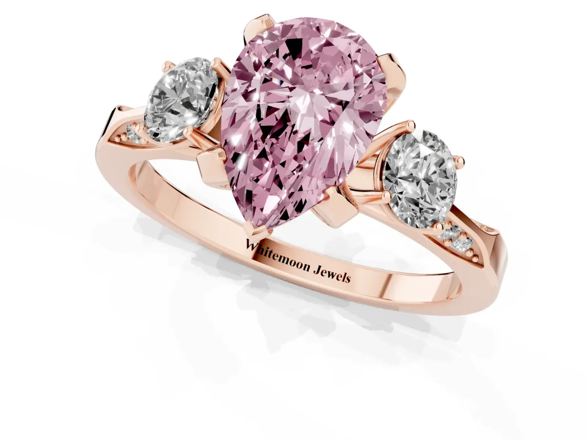 Fancy Pink Pear Cut Brilliant Three-Stone Diamond Ring with Pavé Band and Four-Prong Setting Rose gold