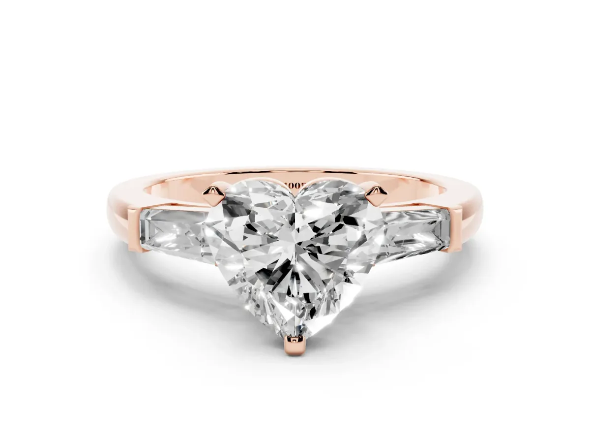 Heart Cut Solitaire with Tapered Baguette Side Stones on a Classic Band with Four-Prong Setting Rose gold