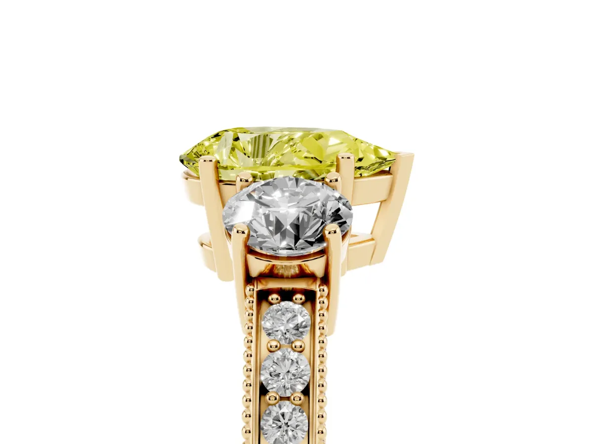 Fancy Yellow Pear Cut Three-Stone Diamond Ring with Pavé Band and Four-Prong Setting Yellow gold
