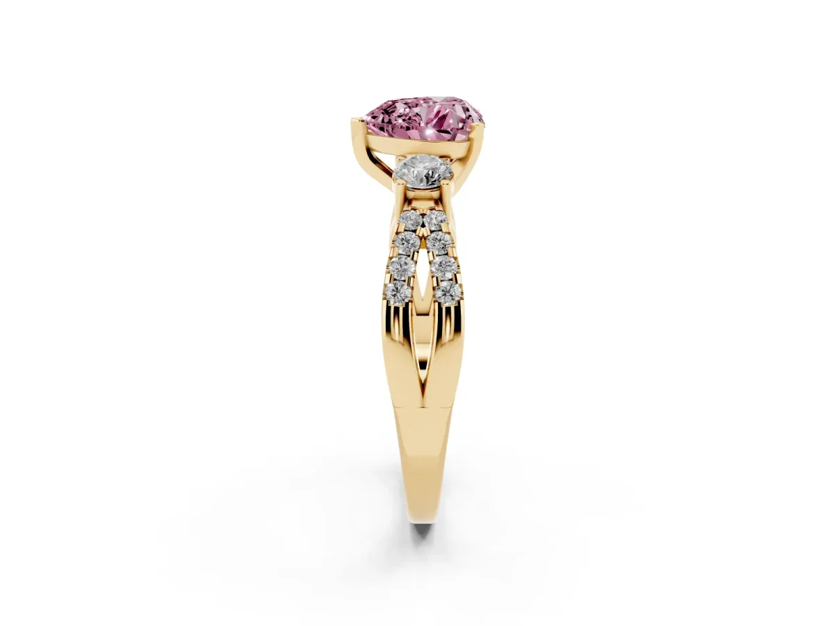 Fancy Pink Heart Cut Diamond Three-Stone Ring with Pavé Split Shank and Four-Prong Setting Yellow gold