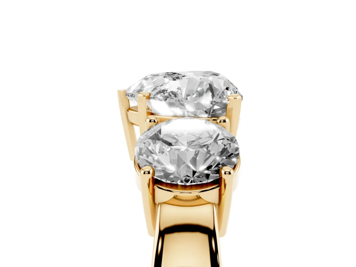 Three-Stone Heart Cut Diamond Ring with Round Side Stones, Classic Band, and Four-Prong Setting Yellow gold