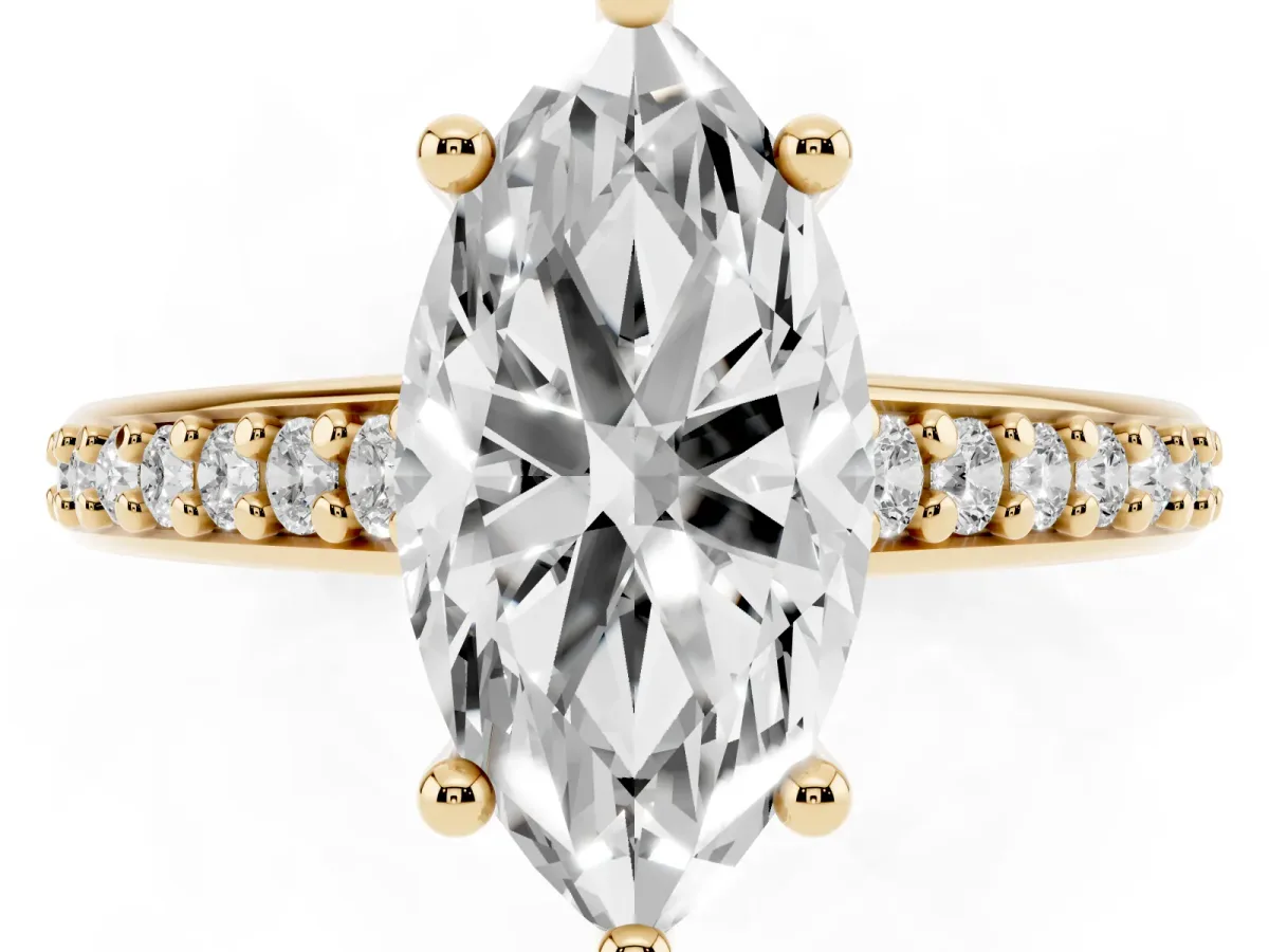 Marquise Cut Solitaire Prong Set Diamond Engagement Ring with Pave Band Yellow gold