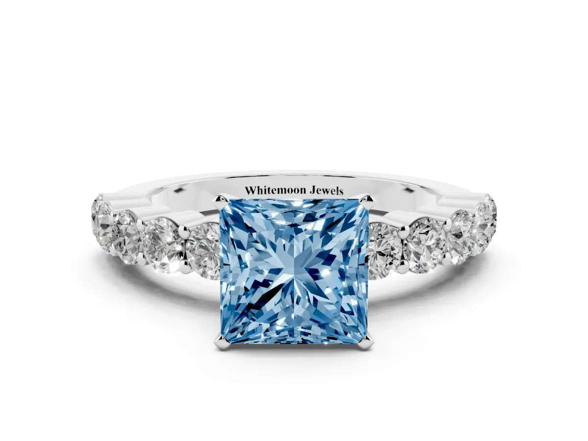 Fancy Blue Princess Cut Diamond Solitaire Ring with Shared Prong Round Side Stones Platinum