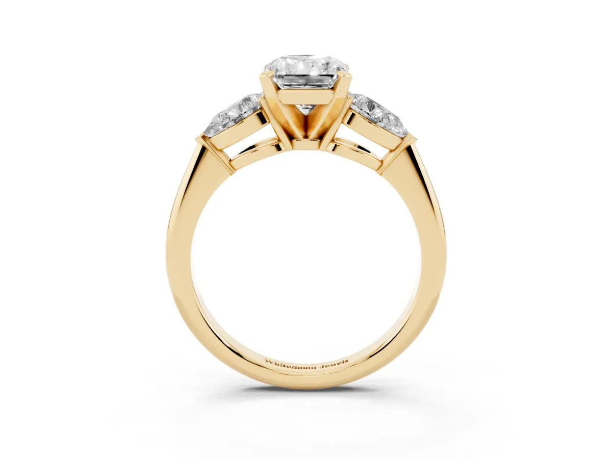Three-Stone Radiant Cut Diamond Ring with Pear Side Stones and Four-Prong Setting Yellow gold