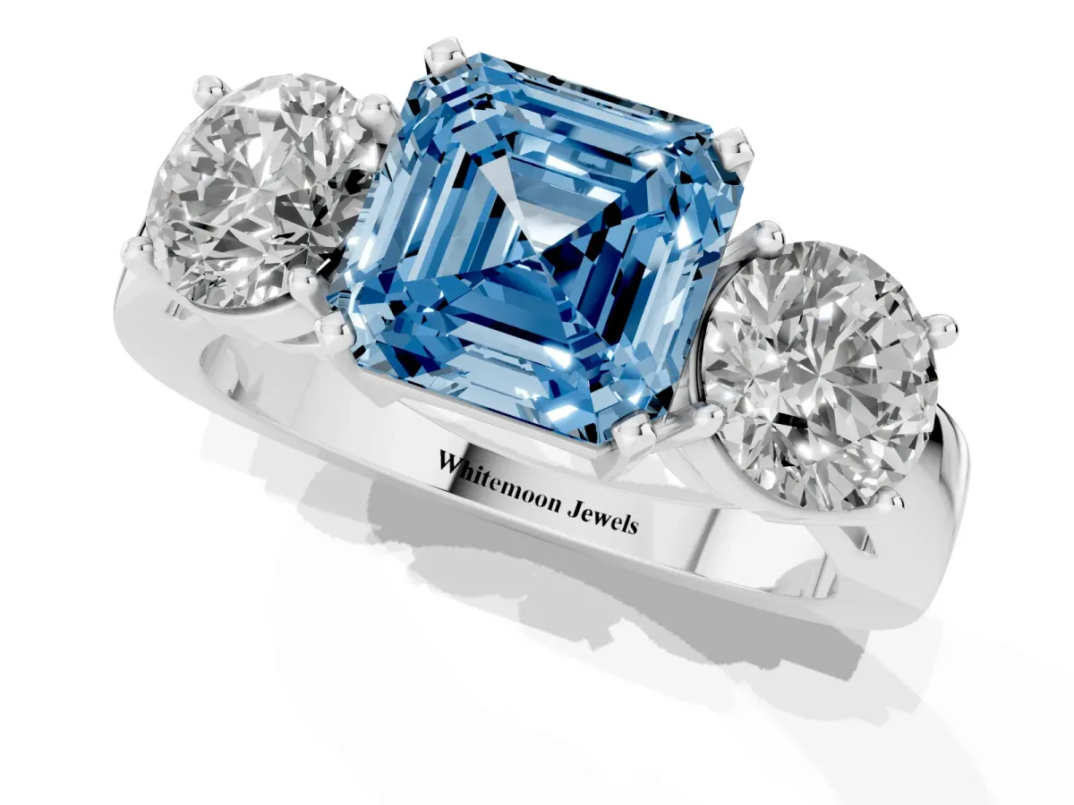 Fancy Blue Three-Stone Asscher Cut Diamond Ring with Round Side Stones, Classic Band, and Four-Prong Setting White gold