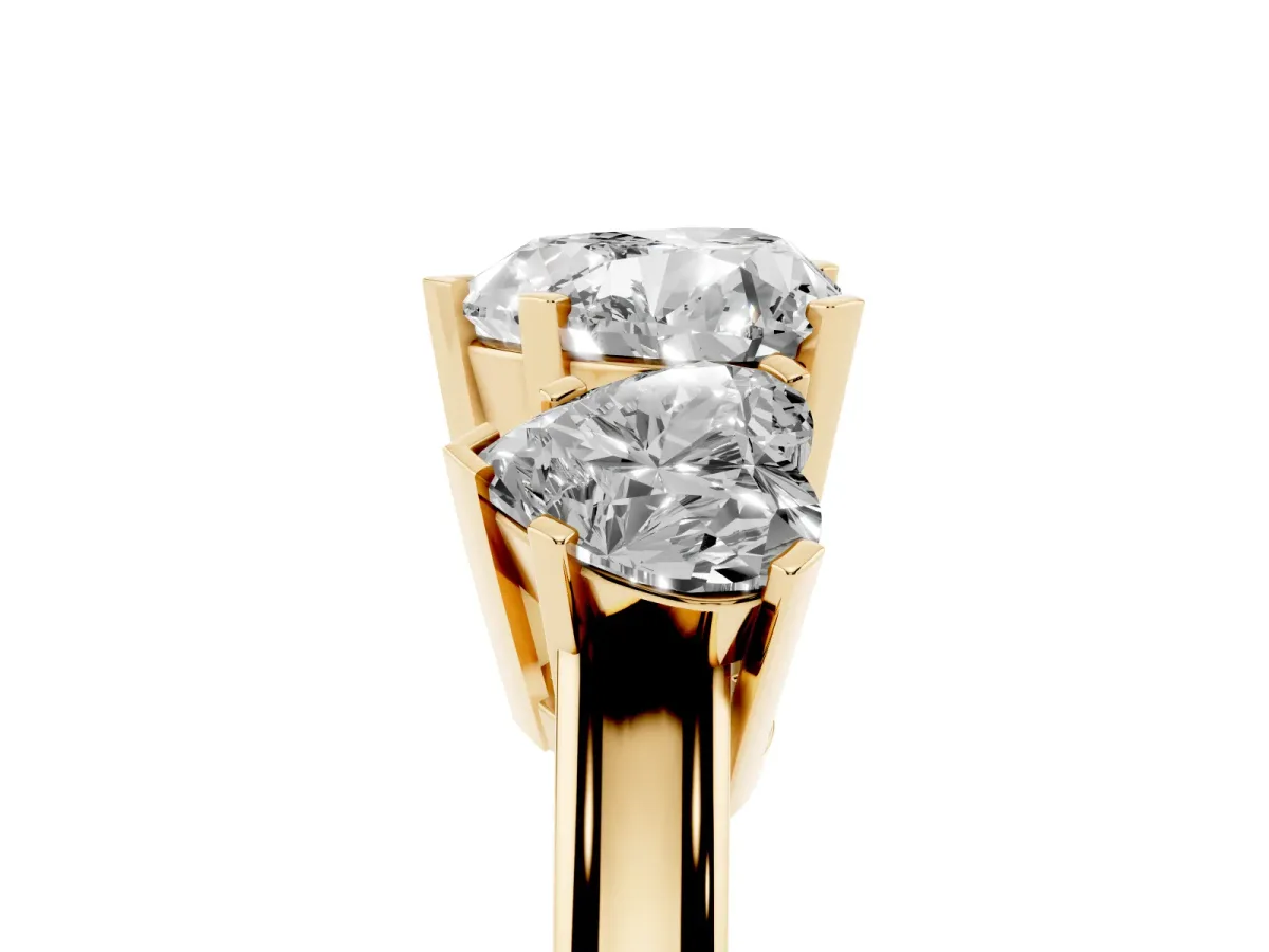 Three-Stone Heart Cut Cut Diamond Ring with Channel Set Band and Four-Prong Setting Yellow gold