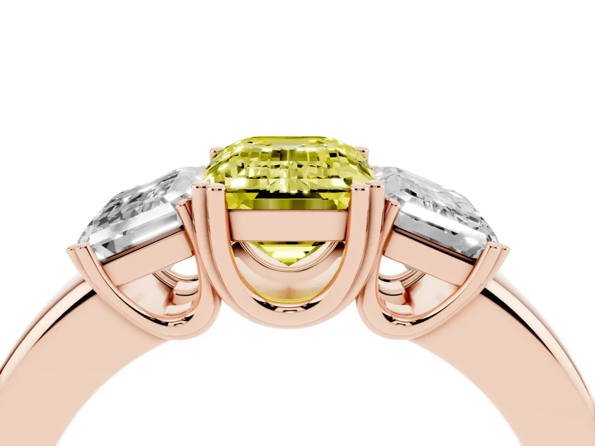 Fancy Yellow Three-Stone Emerald Cut Cut Diamond Ring with Channel Set Band and Four-Prong Setting Rose gold