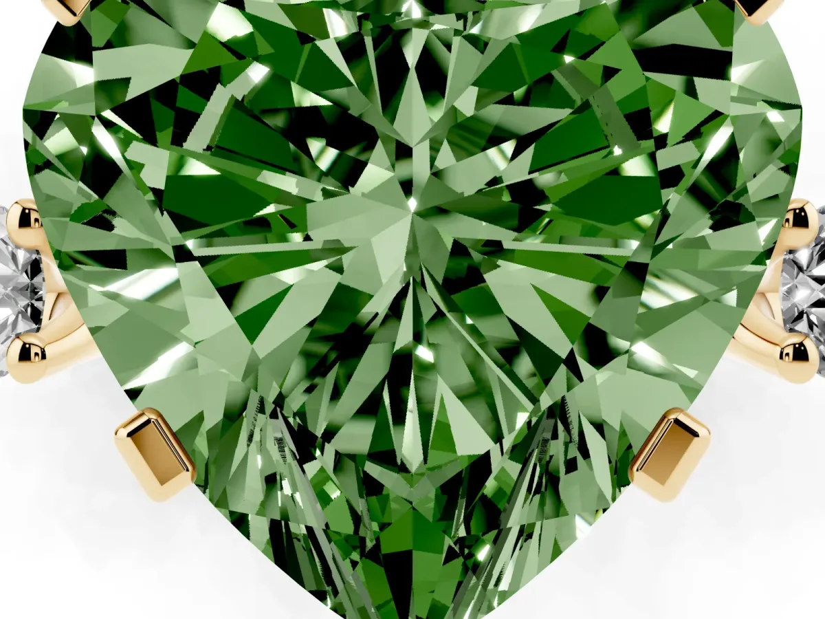Fancy Green Heart Cut Cut Three-Stone Solitaire Ring with Round Accent Diamonds and Four-Prong Setting Yellow gold