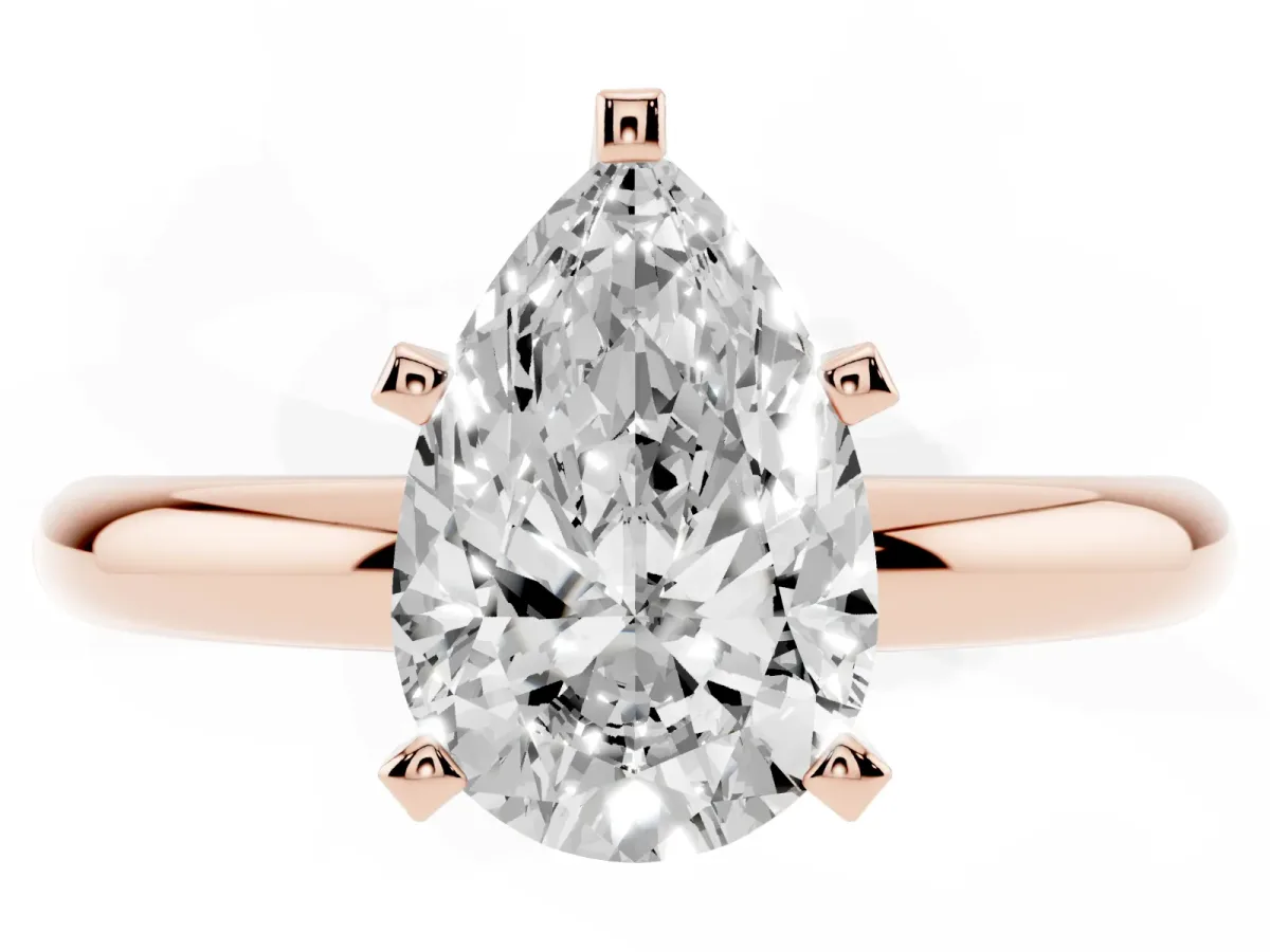Pear Cut Diamond Solitaire Engagement Ring with Round Band and Four-Prong Setting Rose gold