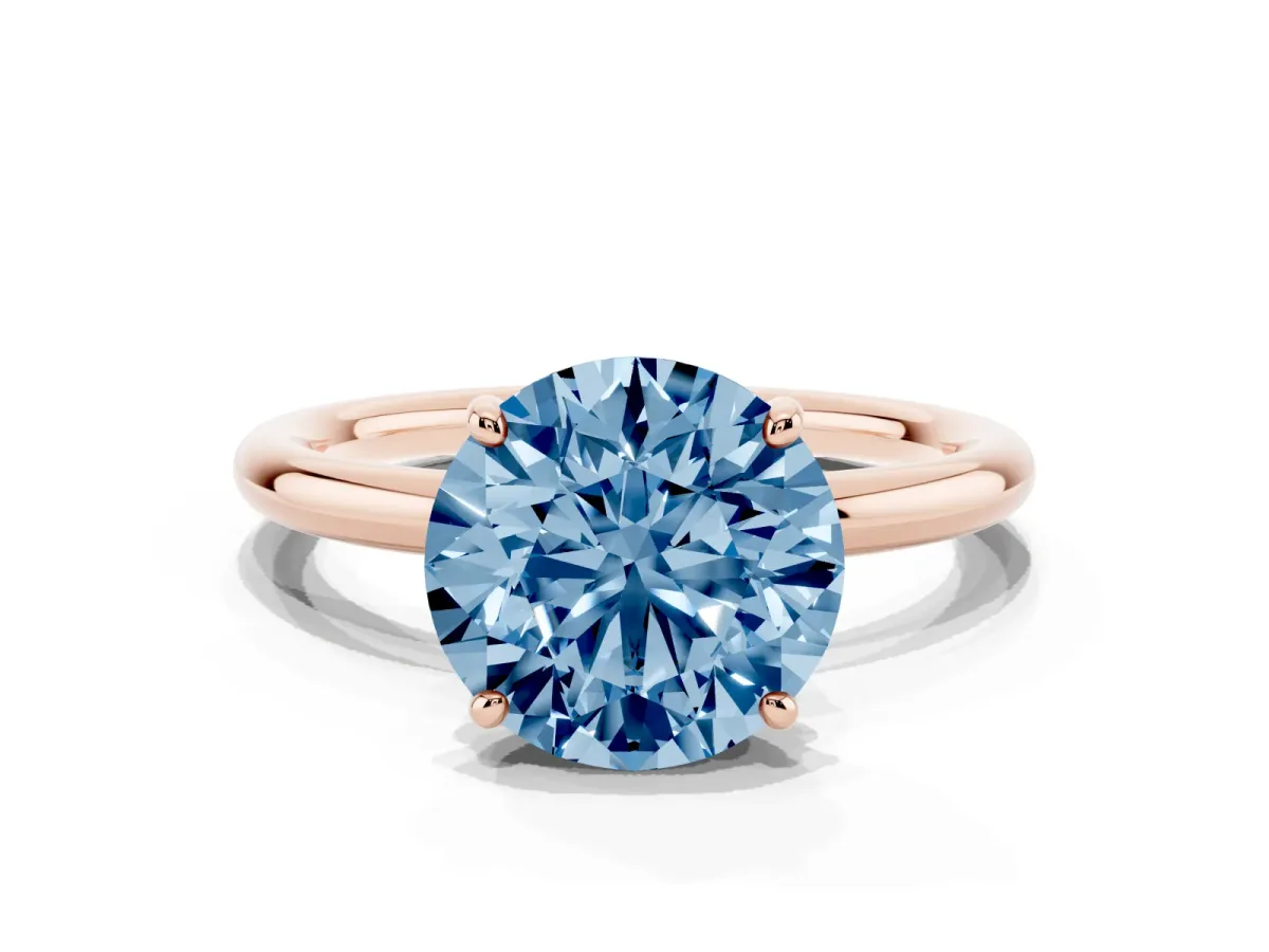 Fancy Blue Round Cut Solitaire Diamond Ring with Four-Prong Setting on a Plain Band Rose gold