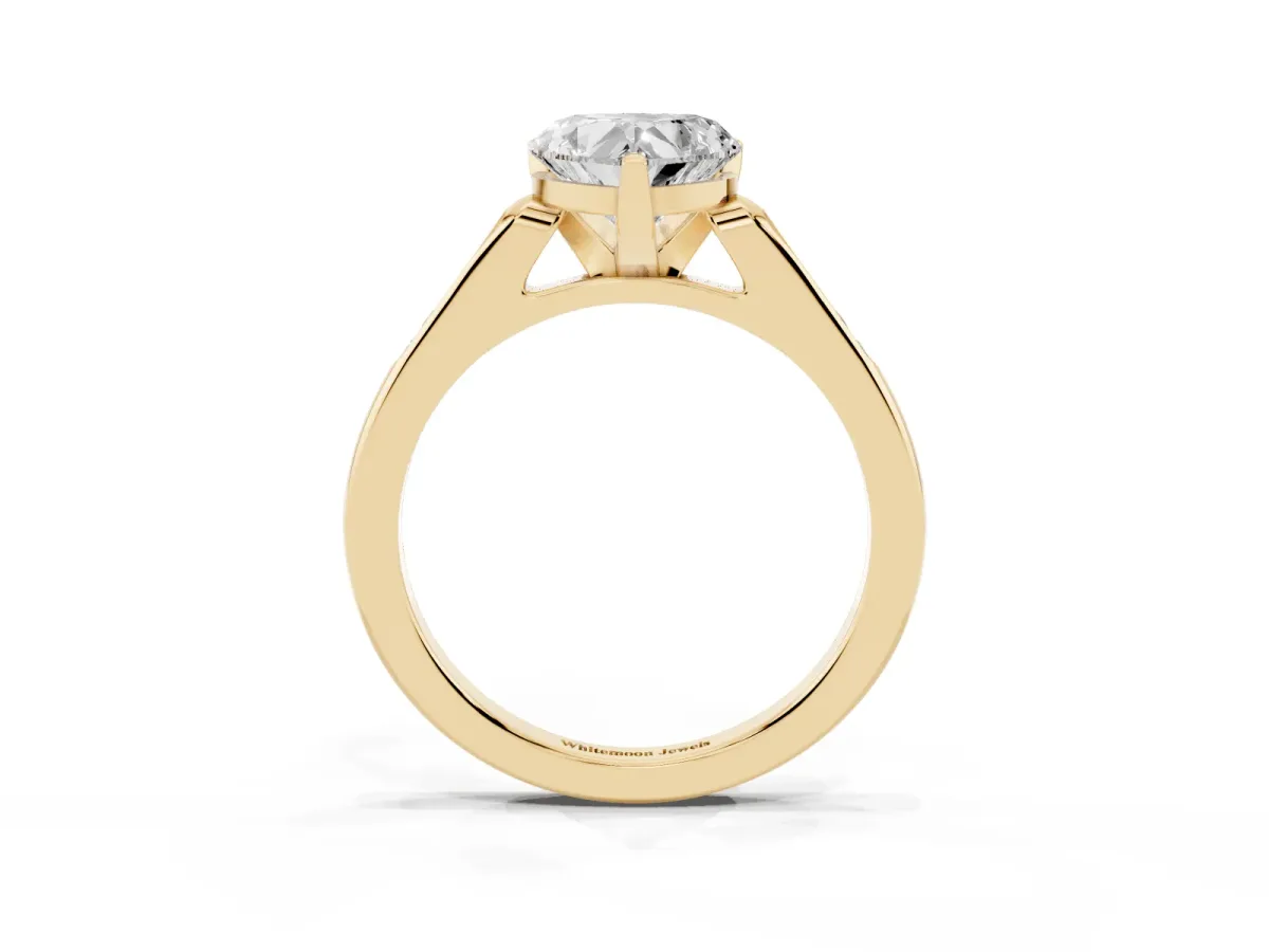 Heart Cut Diamond Solitaire Ring with Channel Set Round Band and Prong Setting Yellow gold