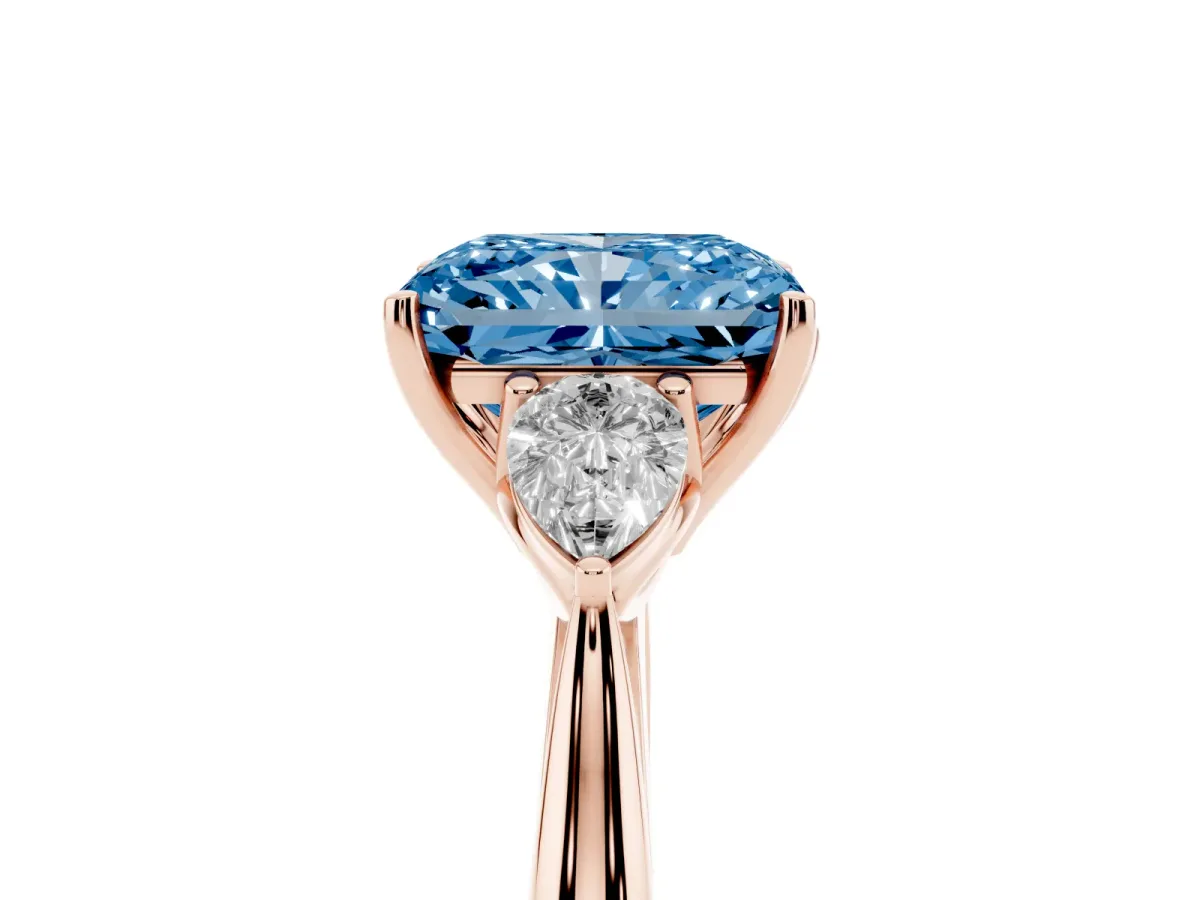 Fancy Blue Radiant Cut Diamond Three-Stone Ring with Pear Side Stones and Prong Setting Rose gold
