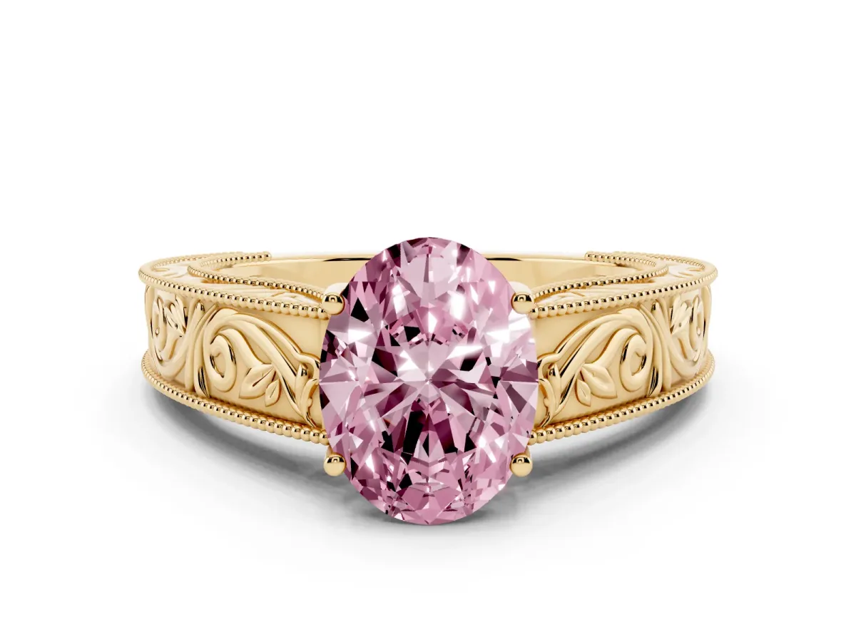 Fancy Pink Oval Cut Diamond Solitaire Ring with Engraved Band and Four-Prong Setting Yellow gold