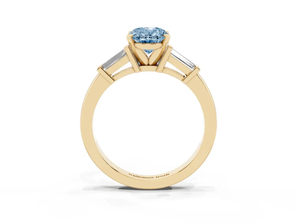 Fancy Blue Oval Cut Cut Diamond Solitaire Ring with Tapered Baguette Accents and Four-Prong Setting Yellow gold